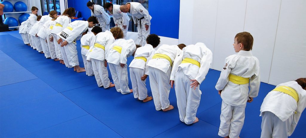 V7 young brazilian jiu jitsu kids bowing at the beginning of class